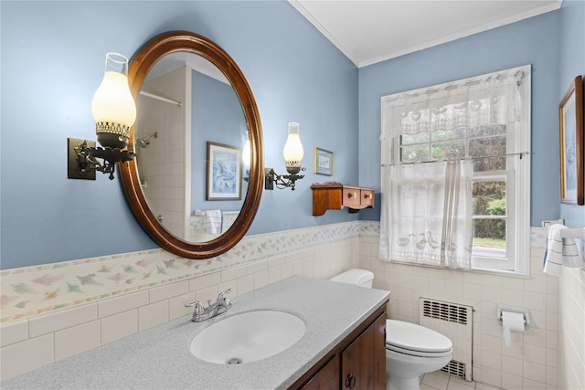 1015 Knollwood Ln, Mattituck, NY 11952 - full bathroom featuring radiator heating unit, tile walls, vanity, a wainscoted wall, and ornamental molding
