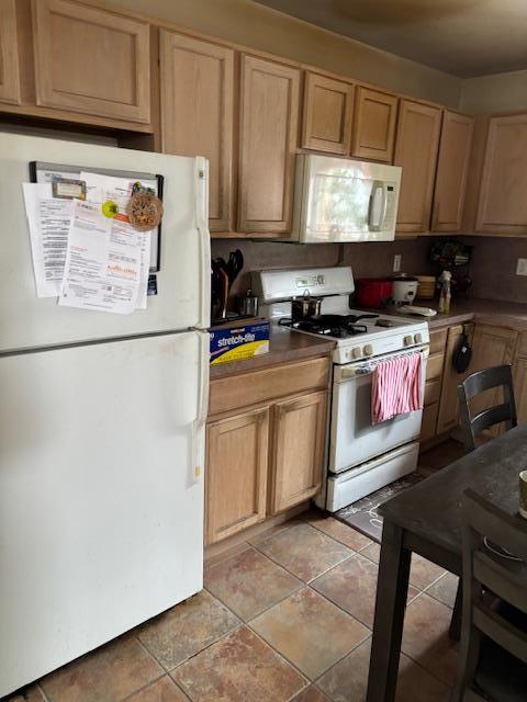 459 Monroe Blvd, Long Beach, NY 11561 - kitchen featuring white appliances and light brown cabinets