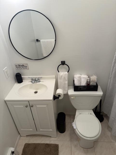 459 Monroe Blvd, Long Beach, NY 11561 - full bath featuring tile patterned floors, vanity, and toilet
