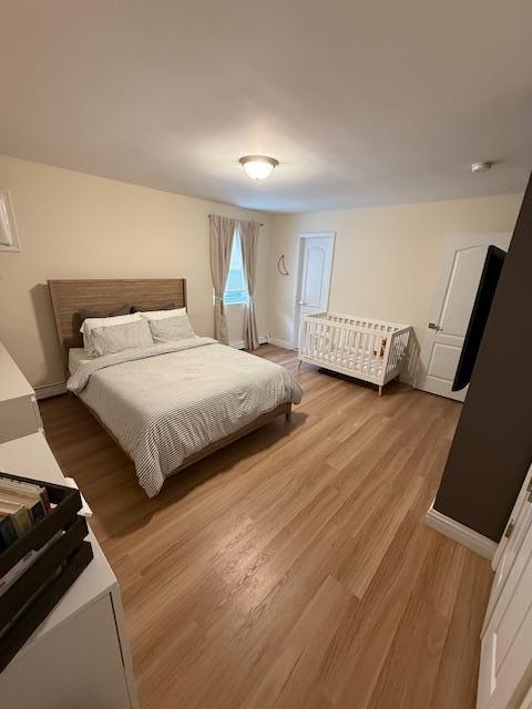 459 Monroe Blvd, Long Beach, NY 11561 - bedroom featuring light wood finished floors and baseboards