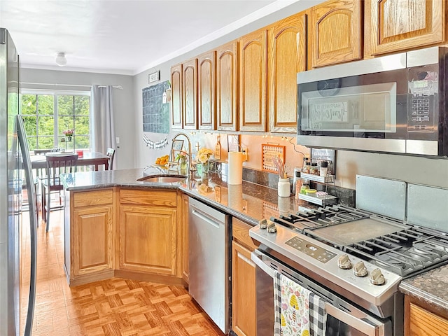 5705 Boulder Way, Wappingers Falls, NY 12590 - kitchen with appliances with stainless steel finishes, a sink, a peninsula, and dark stone counters