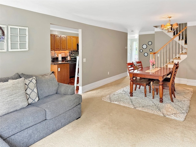 5705 Boulder Way, Wappingers Falls, NY 12590 - dining area with light colored carpet, a chandelier, stairs, and baseboards