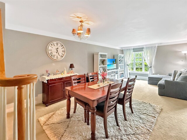 5705 Boulder Way, Wappingers Falls, NY 12590 - dining space with light colored carpet and a chandelier