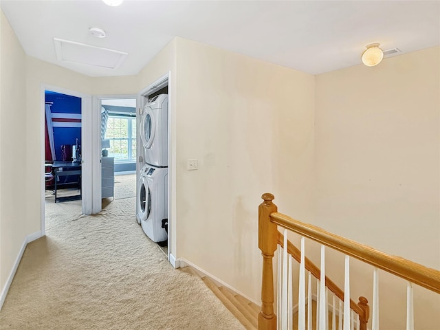 5705 Boulder Way, Wappingers Falls, NY 12590 - washroom with stacked washer / dryer, attic access, baseboards, and light carpet