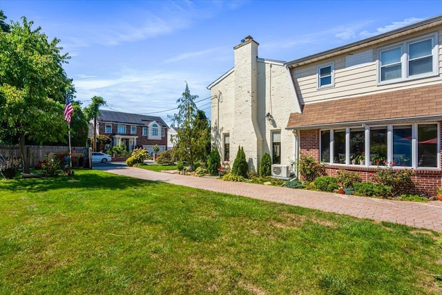 2957 214th Pl, Bayside, NY 11360 - view of side of property featuring brick siding, a chimney, and roof with shingles