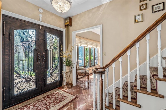 2957 214th Pl, Bayside, NY 11360 - entrance foyer with marble tiled floors, french doors, and stairs