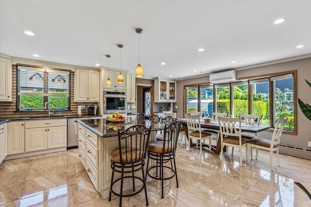 2957 214th Pl, Bayside, NY 11360 - kitchen with cream cabinets, a sink, appliances with stainless steel finishes, recessed lighting, and ornamental molding