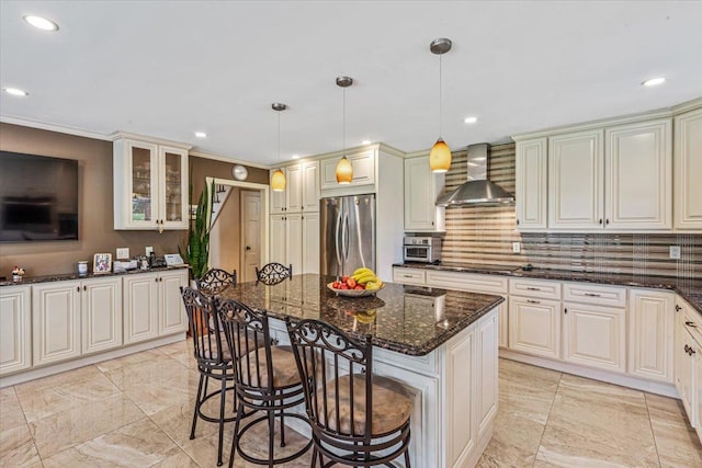 2957 214th Pl, Bayside, NY 11360 - kitchen with freestanding refrigerator, wall chimney exhaust hood, tasteful backsplash, black electric cooktop, and a kitchen bar