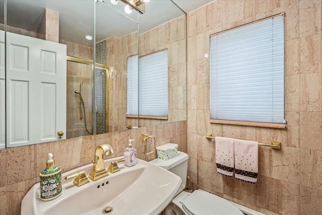 2957 214th Pl, Bayside, NY 11360 - full bathroom with a sink, a stall shower, tile walls, and toilet