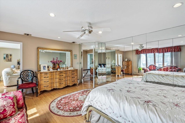 2957 214th Pl, Bayside, NY 11360 - bedroom with hardwood / wood-style flooring, recessed lighting, and baseboard heating