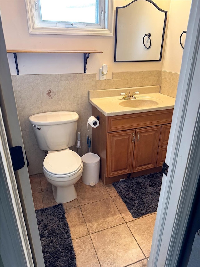 131 E Alhambra Ave, Lindenhurst, NY 11757 - half bath with vanity, toilet, tile patterned floors, and tile walls