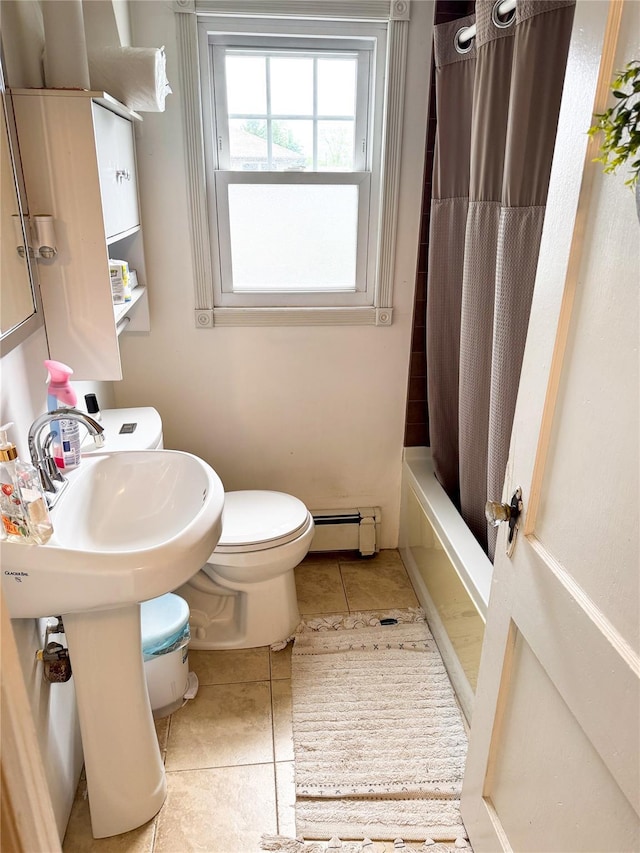 131 E Alhambra Ave, Lindenhurst, NY 11757 - bathroom featuring a baseboard radiator, tile patterned floors, toilet, and shower / bath combo with shower curtain