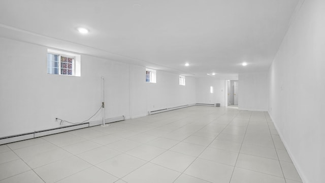 907 Clarence Ave, Bronx, NY 10465 - basement featuring a baseboard heating unit, recessed lighting, and healthy amount of natural light