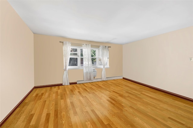 151-84 17th Rd, Whitestone, NY 11357 - empty room with light wood-style floors, a baseboard radiator, and baseboards