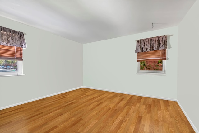 151-84 17th Rd, Whitestone, NY 11357 - spare room with light wood-type flooring and baseboards