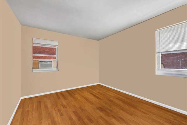 151-84 17th Rd, Whitestone, NY 11357 - spare room with baseboards, wood finished floors, and cooling unit
