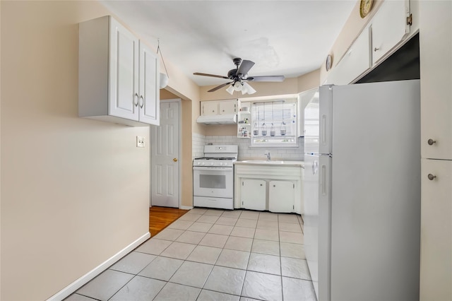 151-84 17th Rd, Whitestone, NY 11357 - kitchen with white appliances, ceiling fan, white cabinetry, and a sink