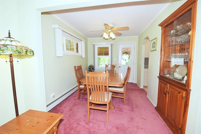 11 Cinque Dr, Farmingdale, NY 11735 - dining room with a baseboard radiator, light colored carpet, ornamental molding, arched walkways, and a ceiling fan