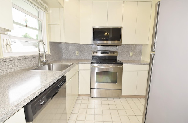 11 Cinque Dr, Farmingdale, NY 11735 - kitchen featuring appliances with stainless steel finishes, a sink, light countertops, and decorative backsplash
