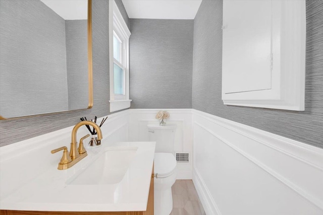 6 Mcbride Ave, White Plains, NY 10603 - half bath with toilet, a wainscoted wall, vanity, and tile patterned floors