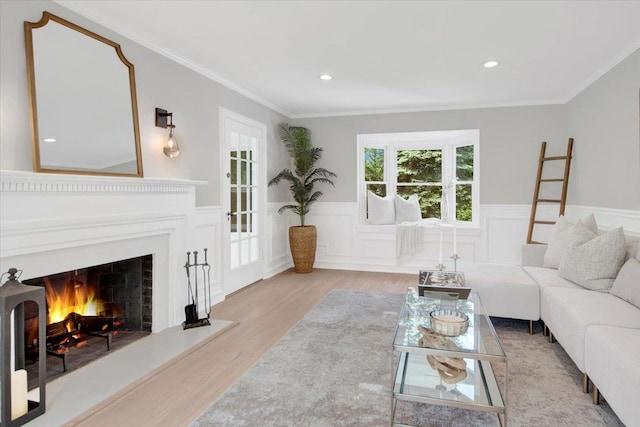 6 Mcbride Ave, White Plains, NY 10603 - living room featuring wood finished floors, wainscoting, a lit fireplace, crown molding, and recessed lighting