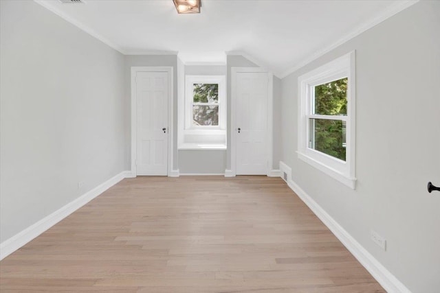 6 Mcbride Ave, White Plains, NY 10603 - unfurnished room with healthy amount of natural light, ornamental molding, vaulted ceiling, baseboards, and light wood-style flooring