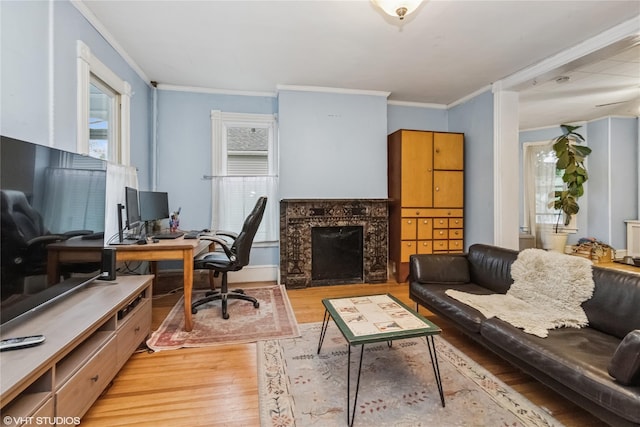 24 John St, Beacon, NY 12508 - office area featuring light wood-style flooring, ornamental molding, and a premium fireplace