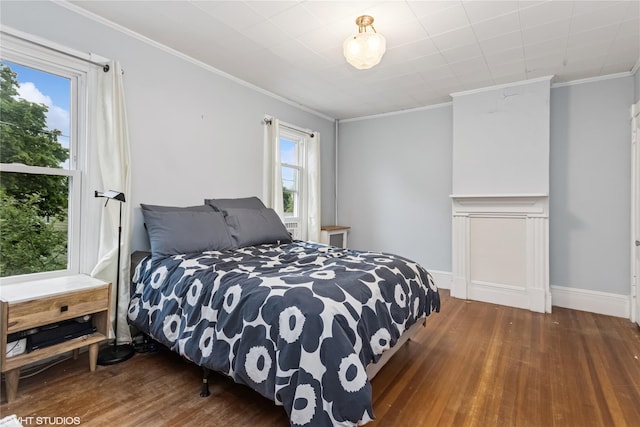 24 John St, Beacon, NY 12508 - bedroom with wood finished floors, crown molding, and baseboards