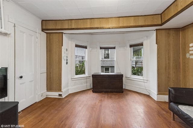24 John St, Beacon, NY 12508 - living area with healthy amount of natural light, wood finished floors, and baseboards