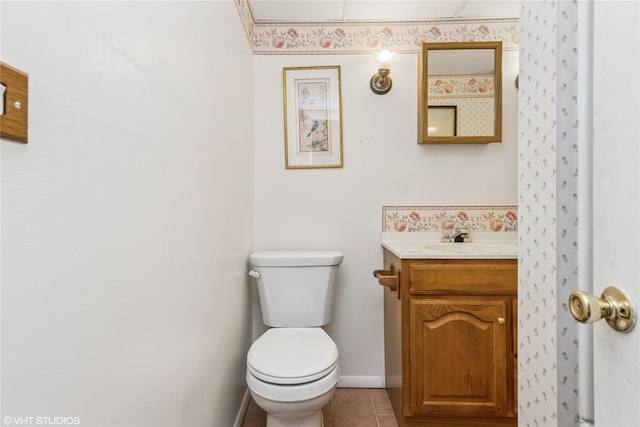 24 John St, Beacon, NY 12508 - bathroom featuring toilet, vanity, tile patterned flooring, and baseboards