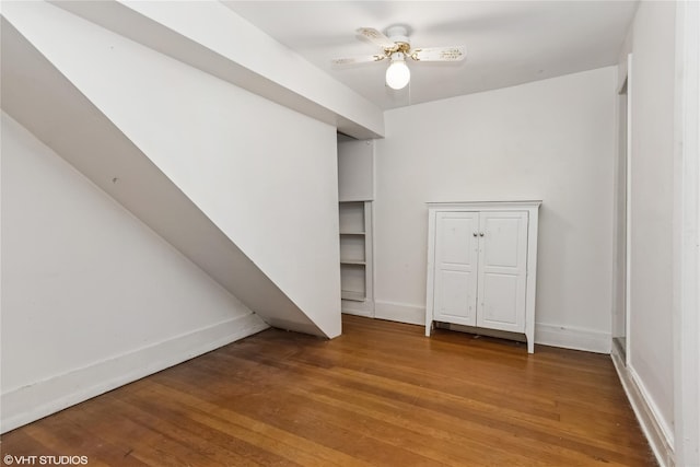 24 John St, Beacon, NY 12508 - unfurnished bedroom with light wood-style flooring, baseboards, and a ceiling fan