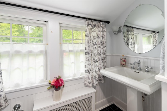 41 Granite Springs Rd, Granite Springs, NY 10527 - bathroom with wainscoting, a sink, radiator heating unit, tile patterned floors, and a decorative wall