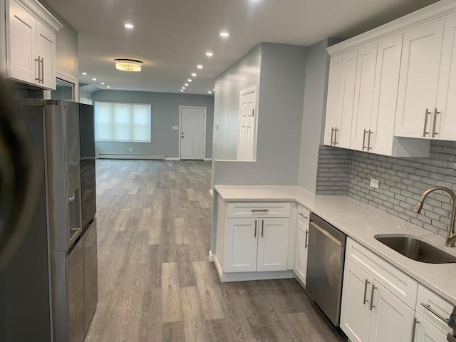 158-04 111th Ave, Jamaica, NY 11433 - kitchen with a sink, stainless steel appliances, backsplash, dark wood finished floors, and recessed lighting