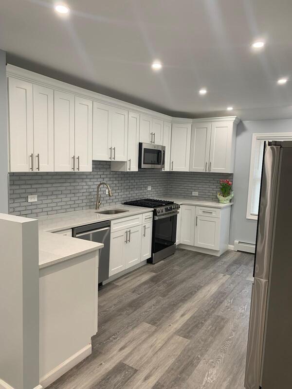158-04 111th Ave, Jamaica, NY 11433 - kitchen featuring appliances with stainless steel finishes, a sink, light countertops, white cabinets, and recessed lighting