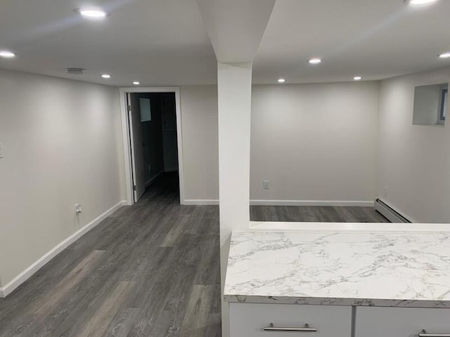 158-04 111th Ave, Jamaica, NY 11433 - finished basement featuring baseboard heating, dark wood-style flooring, baseboards, and recessed lighting