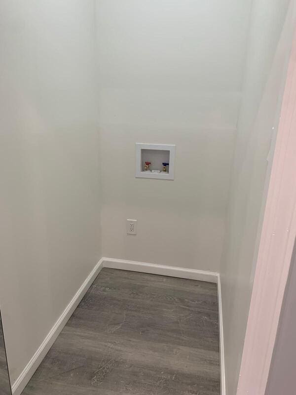 158-04 111th Ave, Jamaica, NY 11433 - laundry area featuring washer hookup, baseboards, and wood finished floors