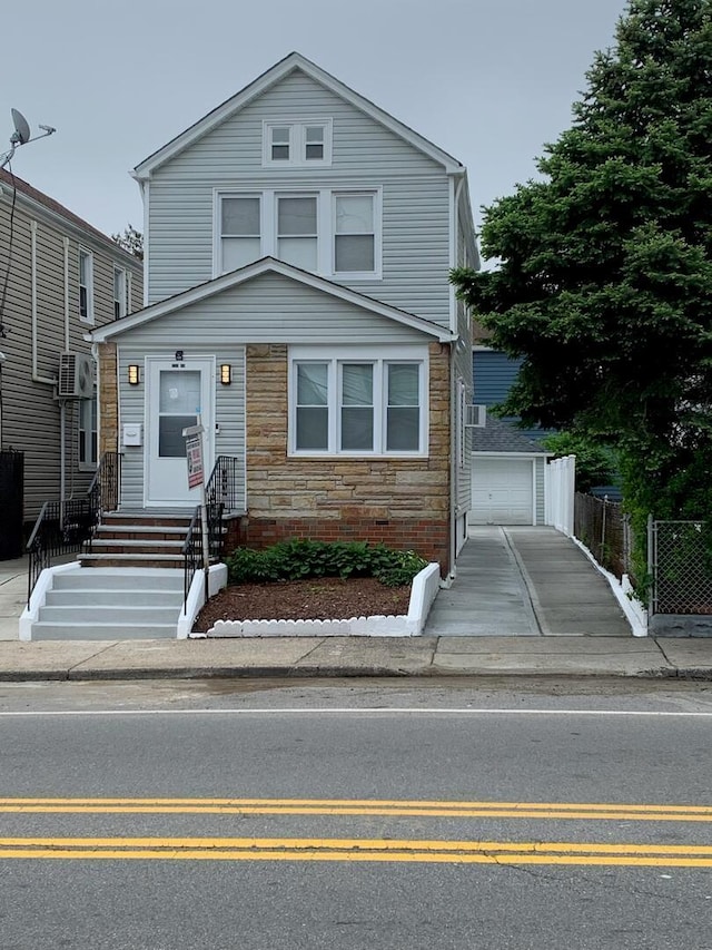 158-04 111th Ave, Jamaica, NY 11433 - view of front facade with fence, entry steps, an outdoor structure, and stone siding