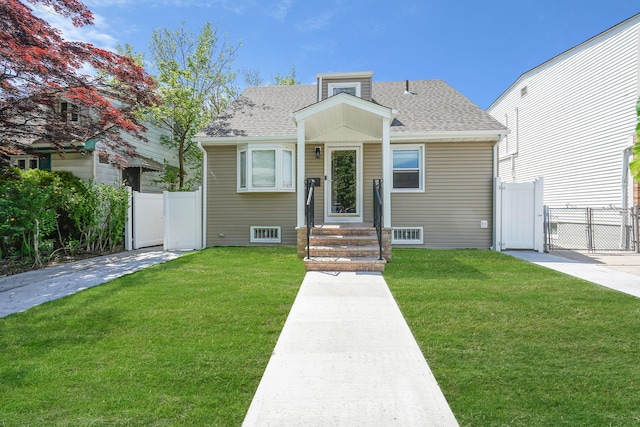 bungalow-style home with a gate and roof with shingles