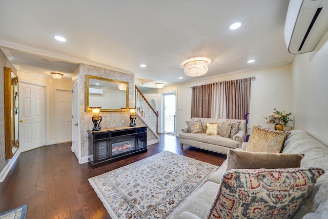 living area with a wall unit AC, crown molding, stairway, dark wood finished floors, and baseboards