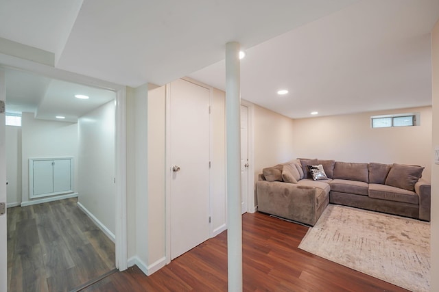 living area with dark wood-style floors, baseboards, and recessed lighting