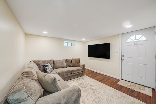living area featuring dark wood-style floors, recessed lighting, and baseboards