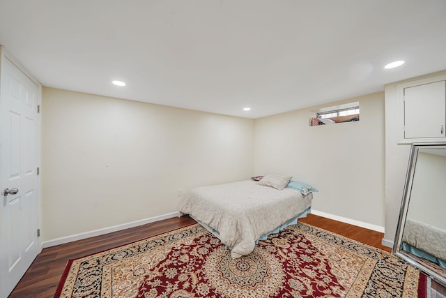 bedroom featuring wood finished floors, baseboards, and recessed lighting