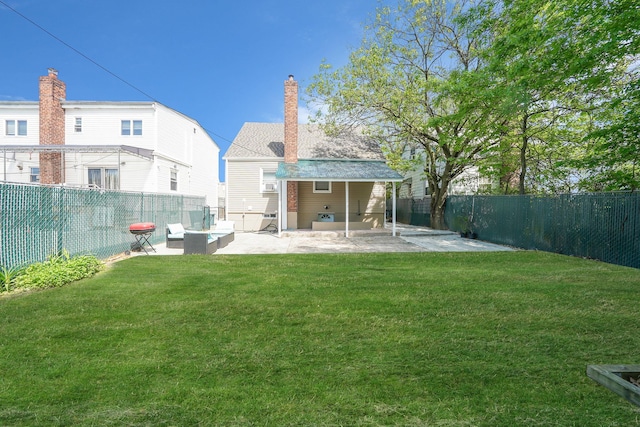 rear view of property featuring a patio area and a chimney
