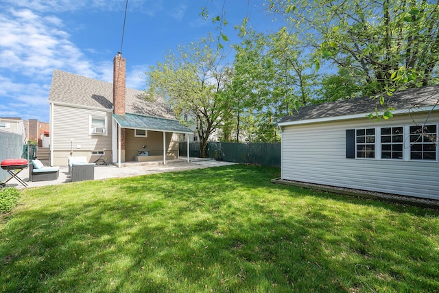 view of yard featuring a patio and an outdoor structure