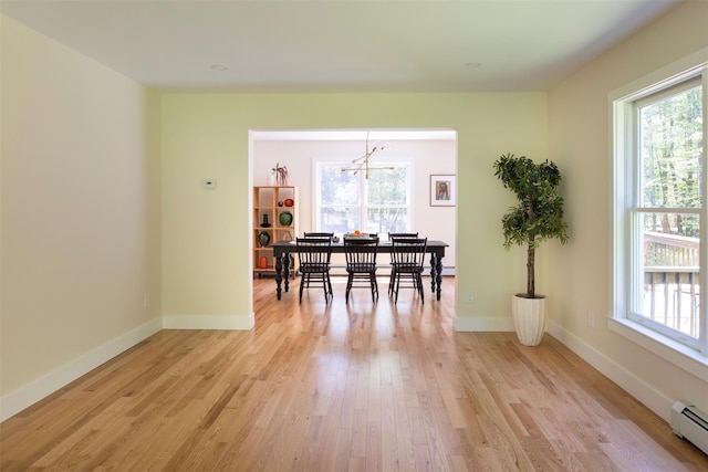 1531 Glasco Tpke, Saugerties, NY 12498 - dining space featuring baseboard heating, a chandelier, light wood finished floors, and baseboards