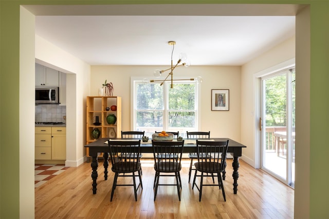 1531 Glasco Tpke, Saugerties, NY 12498 - dining area with a chandelier and light wood finished floors