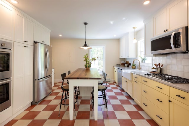 1531 Glasco Tpke, Saugerties, NY 12498 - kitchen with appliances with stainless steel finishes, light floors, a sink, butcher block countertops, and recessed lighting