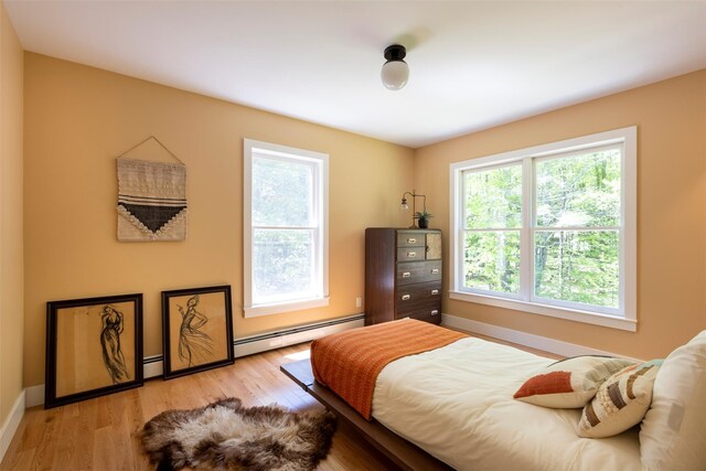 1531 Glasco Tpke, Saugerties, NY 12498 - bedroom with baseboard heating, light wood-style flooring, and baseboards