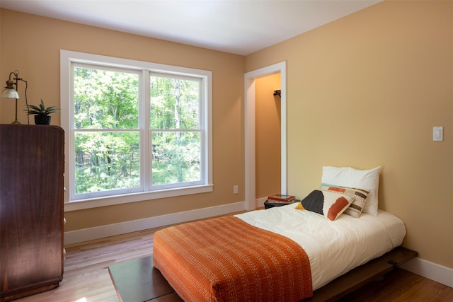 1531 Glasco Tpke, Saugerties, NY 12498 - bedroom featuring multiple windows, light wood-style flooring, and baseboards