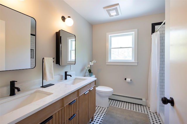 1531 Glasco Tpke, Saugerties, NY 12498 - bathroom with a baseboard heating unit, double vanity, toilet, and baseboards